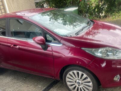 FORD MODEL FIESTA TITANIUM 96  ENGINE SIZE 1.4 Litres FUEL PETROL BODY 5 DOOR HATCHBACK TRANSMISSION MANUAL SEATS 5 COLOUR RED REG DATE 31/07/2010 Mileage: 55400 LO10HDK